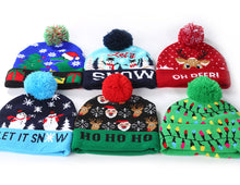 Load image into Gallery viewer, Christmas New Cuffed Ball Knit Hat With LED Colorful Dazzle Lights